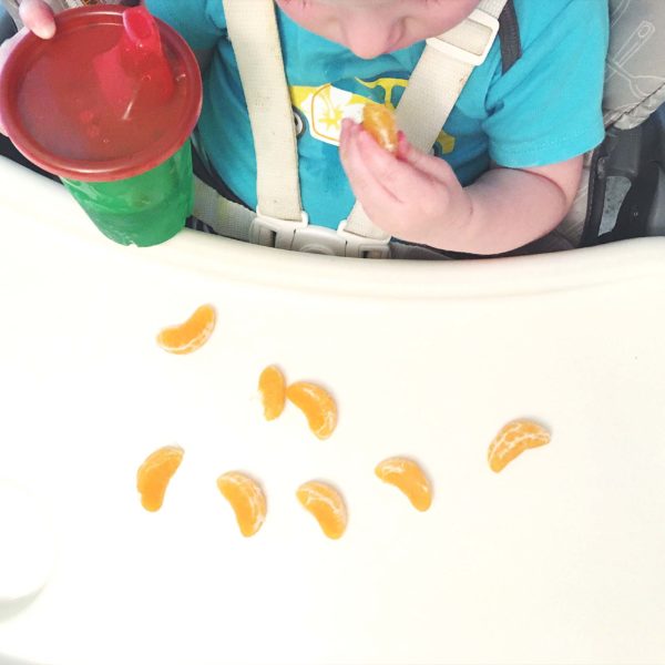 Toddler eating mandarin orange not bought through online grocery ordering