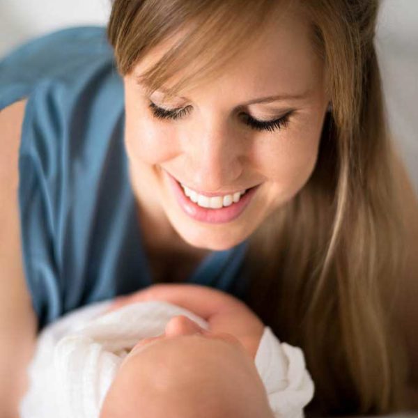 Mom holding newborn baby boy