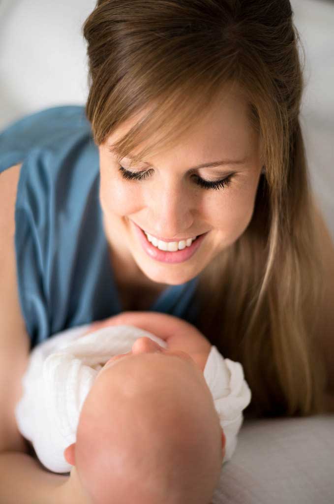 Mom holding newborn baby boy